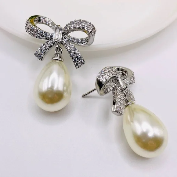 Anthro Shashi Pave Pearl Bow Earrings - Picture 3 of 6